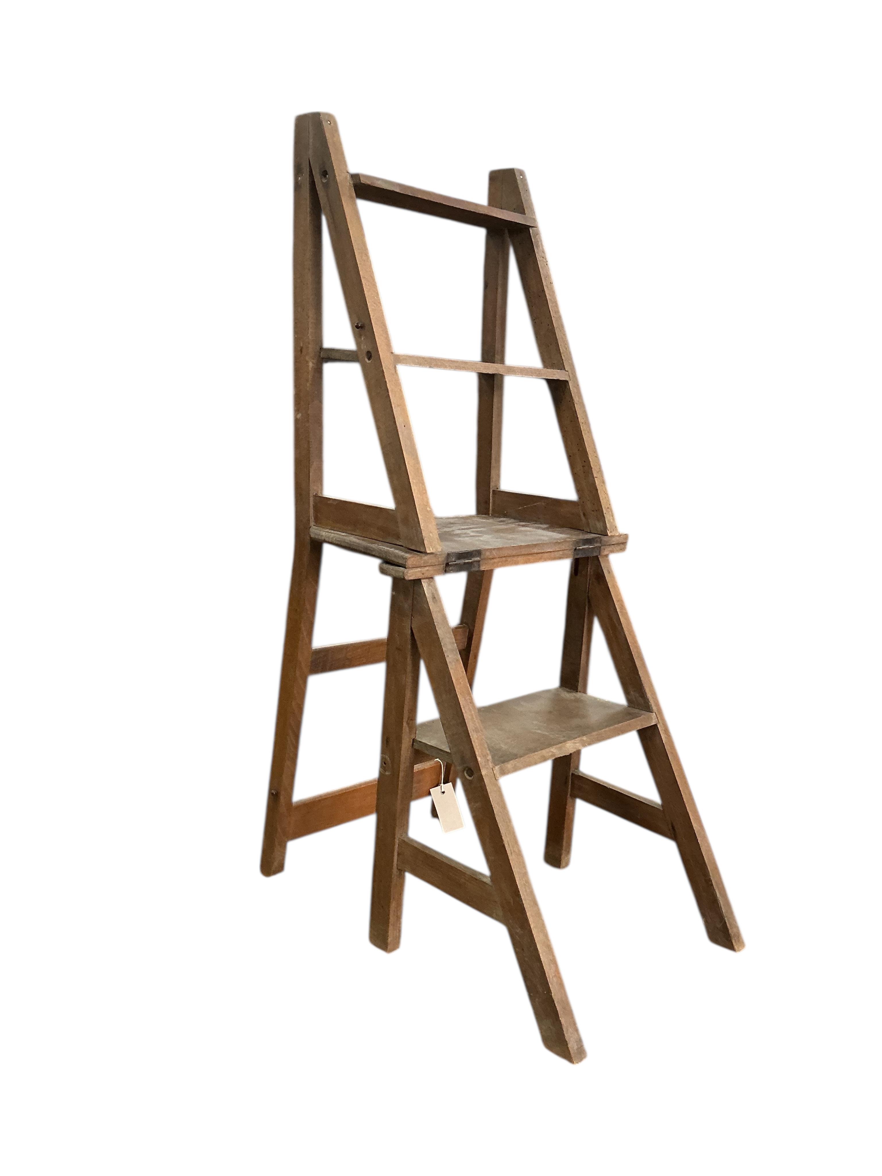 An early 20th century French Provincial beech metamorphic library chair, width 39cm, depth 33cm, height 84cm